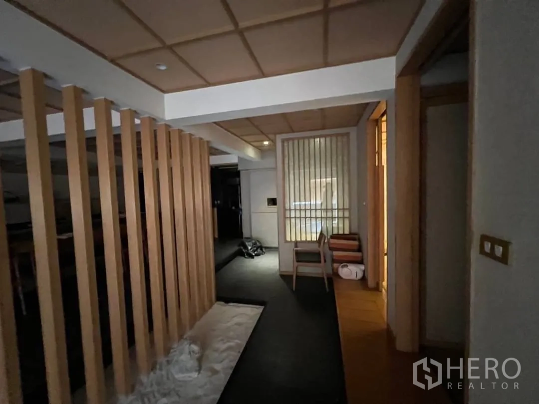 Retail Space for rent - Hallway with vertical wood partitions leading to private dining rooms.
