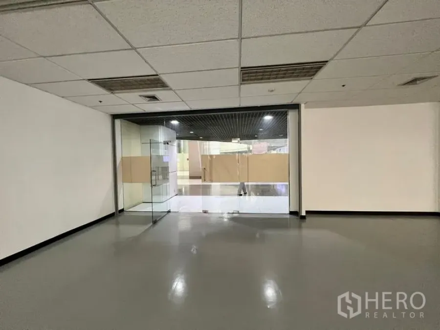 Retail Space for rent - Glass double-door storefront opening to an interior corridor, offering strong visibility and easy customer access.