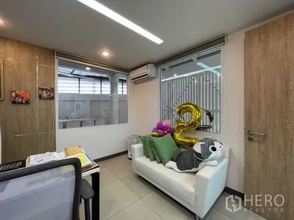 Home Office for rent in Watthana, Bangkok - Cozy manager’s office featuring a white sofa, windows and a wood door.