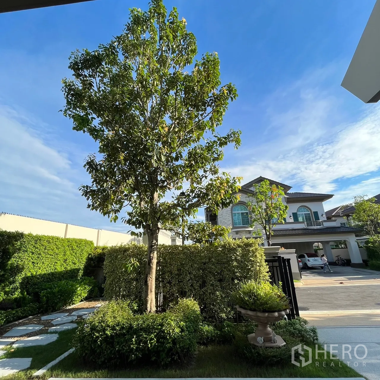 Detached House for rent or sale in Bang Khen, Bangkok - View across quiet street to neighboring luxury homes and trees.