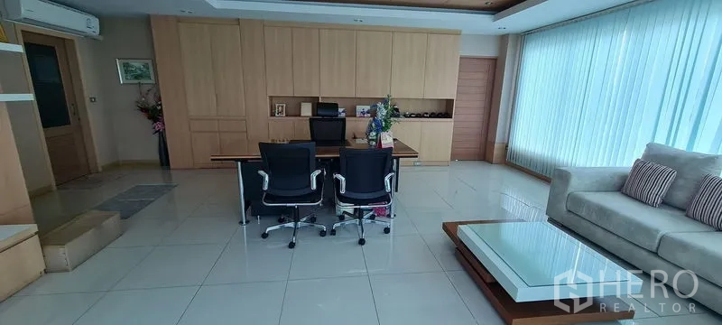 Warehouse for rent or sale in Bang Phli, Samut Prakan - Executive workspace with built-in shelving, lounge corner, and desk.