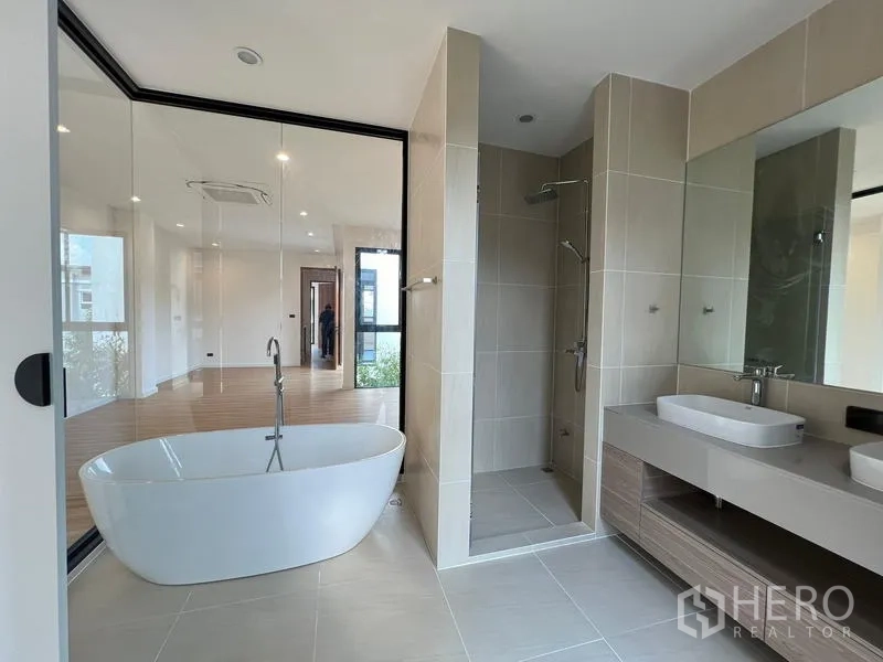 Home Office for sale in Phra Khanong, Bangkok - Master bathroom featuring a freestanding tub, double vanity and separate shower.