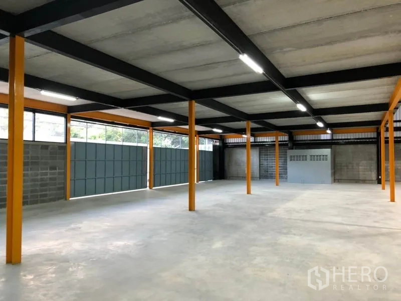 Warehouse for rent in Khlong Toei, Bangkok - Bright upper level beneath concrete slab with long windows and LED strip lighting across the warehouse.