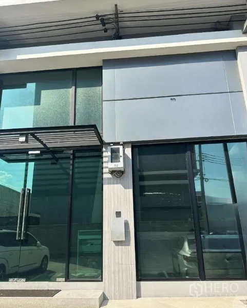Home Office for rent in Bueng Kum, Bangkok - Modern glass-front home office facade with large windows and canopy in Bueng Kum, Bangkok.