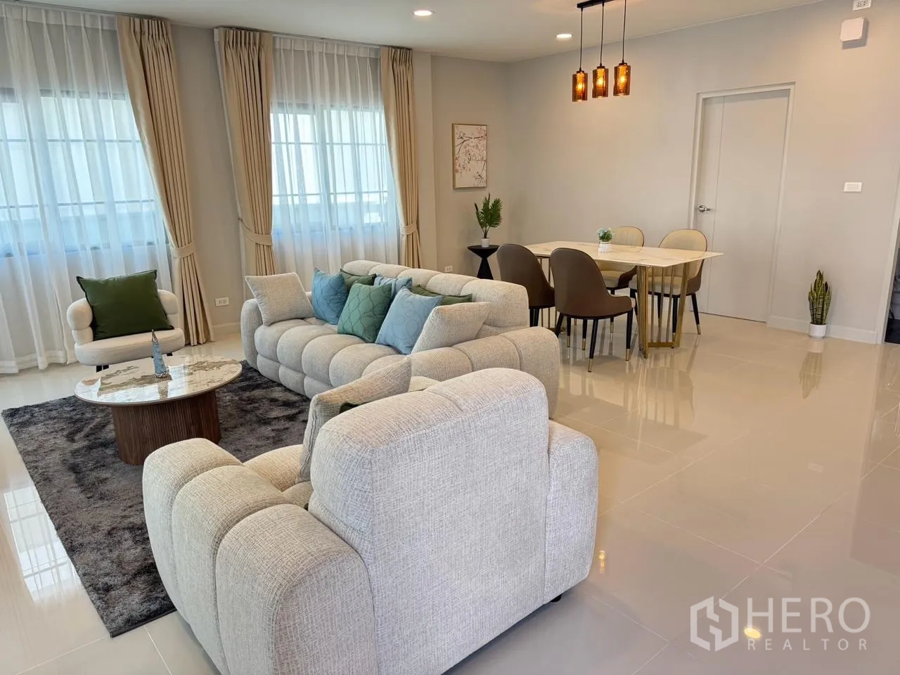 Detached House for rent in Bang Phli, Samut Prakan - Wide view of open-plan lounge and dining area with pendant lights.
