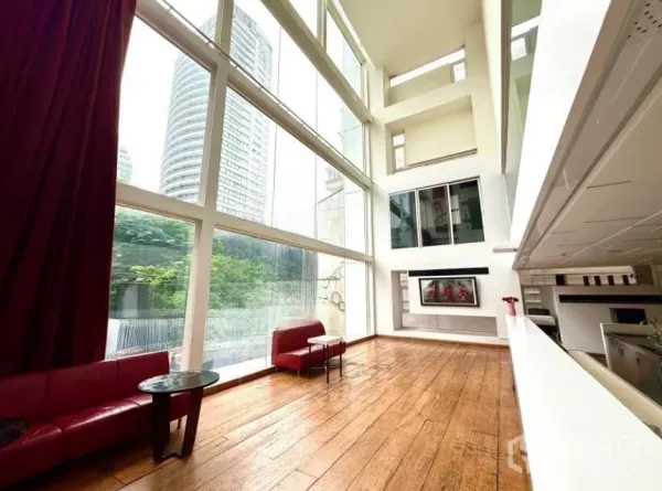 Retail Space for rent in Watthana, Bangkok - Double-height interior with expansive glass walls, wood floors and a bar counter, with city views.