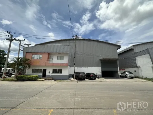 Factory for rent in Phra Nakhon Si Ayutthaya - Front elevation showing the factory with attached two-storey office block and loading bay.
