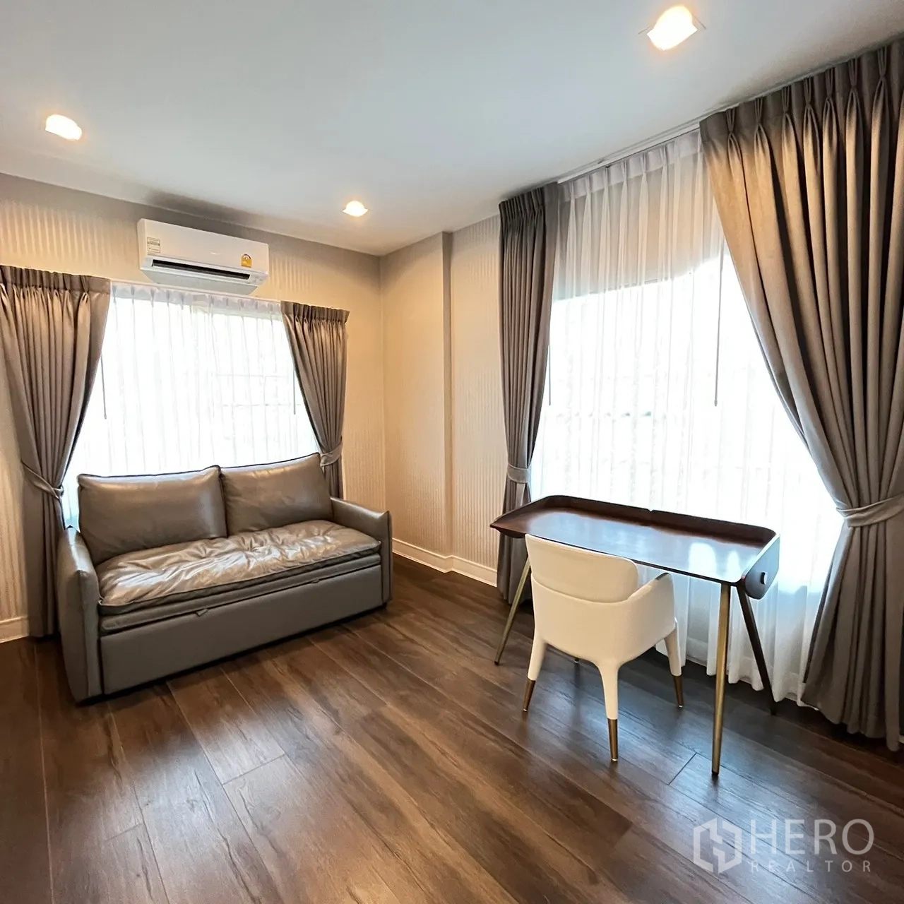 Detached House for rent or sale in Bang Khen, Bangkok - Flexible room used as study or guest space with sofa and desk.