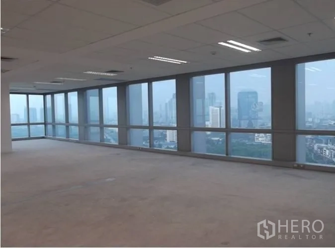 Office Space for rent - Corner office area with full-height glazing showcasing Bangkok skyline views.