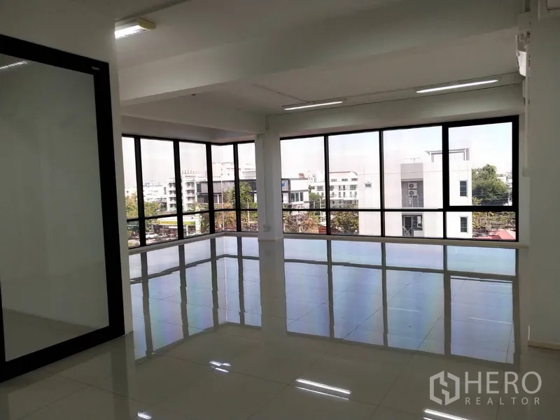 Office Space for rent in Bang Na, Bangkok - Corner office with wraparound windows overlooking Bang Na district.