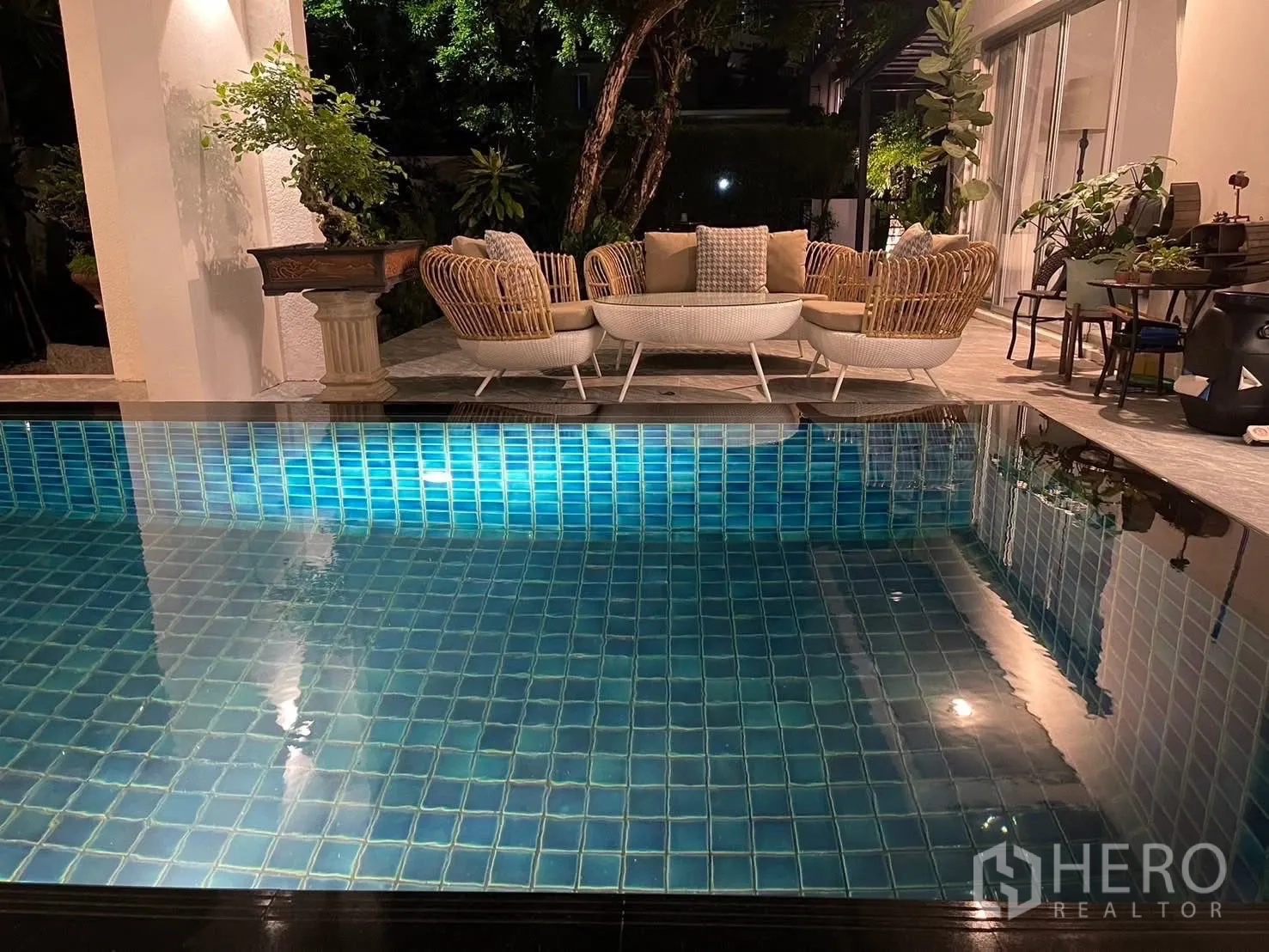 Detached House for rent in Suan Luang, Bangkok - Close-up of illuminated blue-tiled private pool at night.