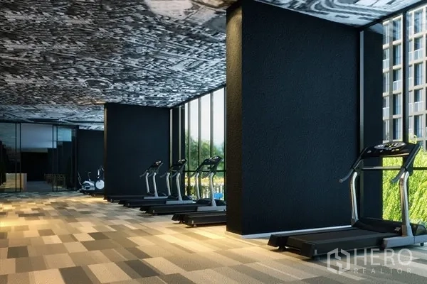 Condominium for rent in Pathum Wan, Bangkok - Fitness room with treadmills and floor-to-ceiling windows.