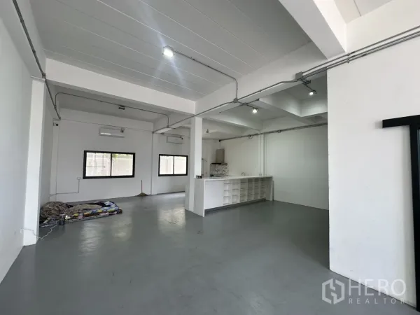 Home Office for rent or sale in Bang Na, Bangkok - Spacious work zone with exposed conduits, windows and a built-in counter.