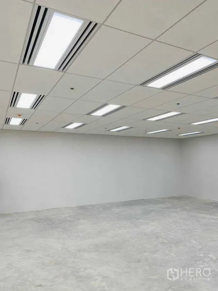 Office Space for rent in Phra Khanong, Bangkok - Suspended grid ceiling with LED light panels and linear air-conditioning vents.