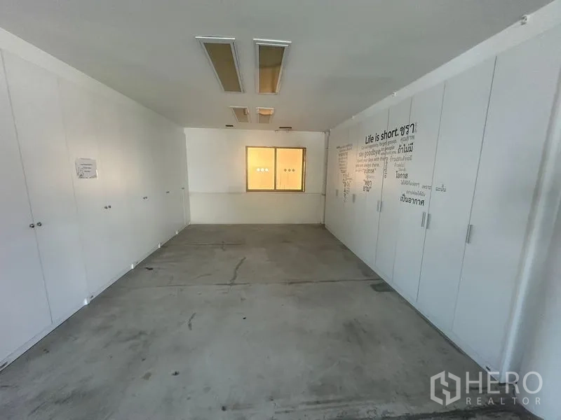 Warehouse for rent in Saphan Sung, Bangkok - Storage or filing room with full-height white cabinets.
