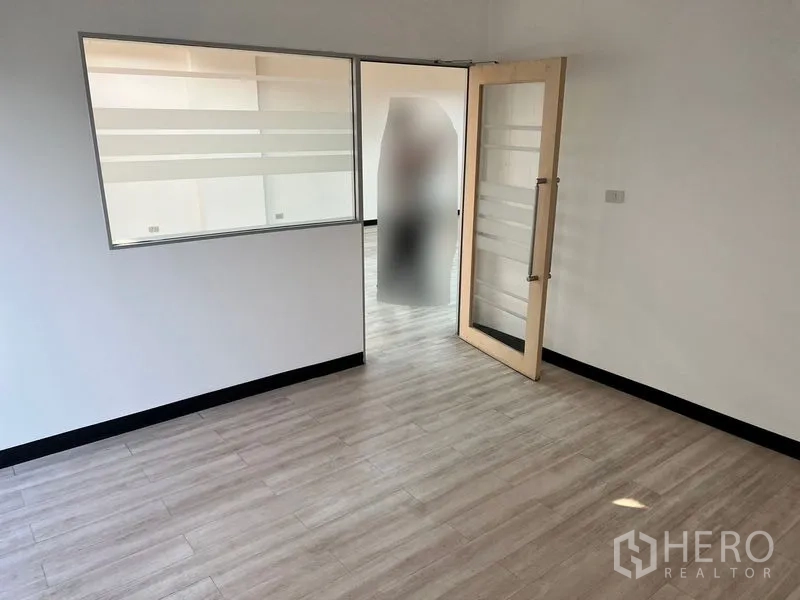 Office Space for rent in Pathum Wan, Bangkok - Meeting room with frosted interior window and glass door opening to the main workspace.
