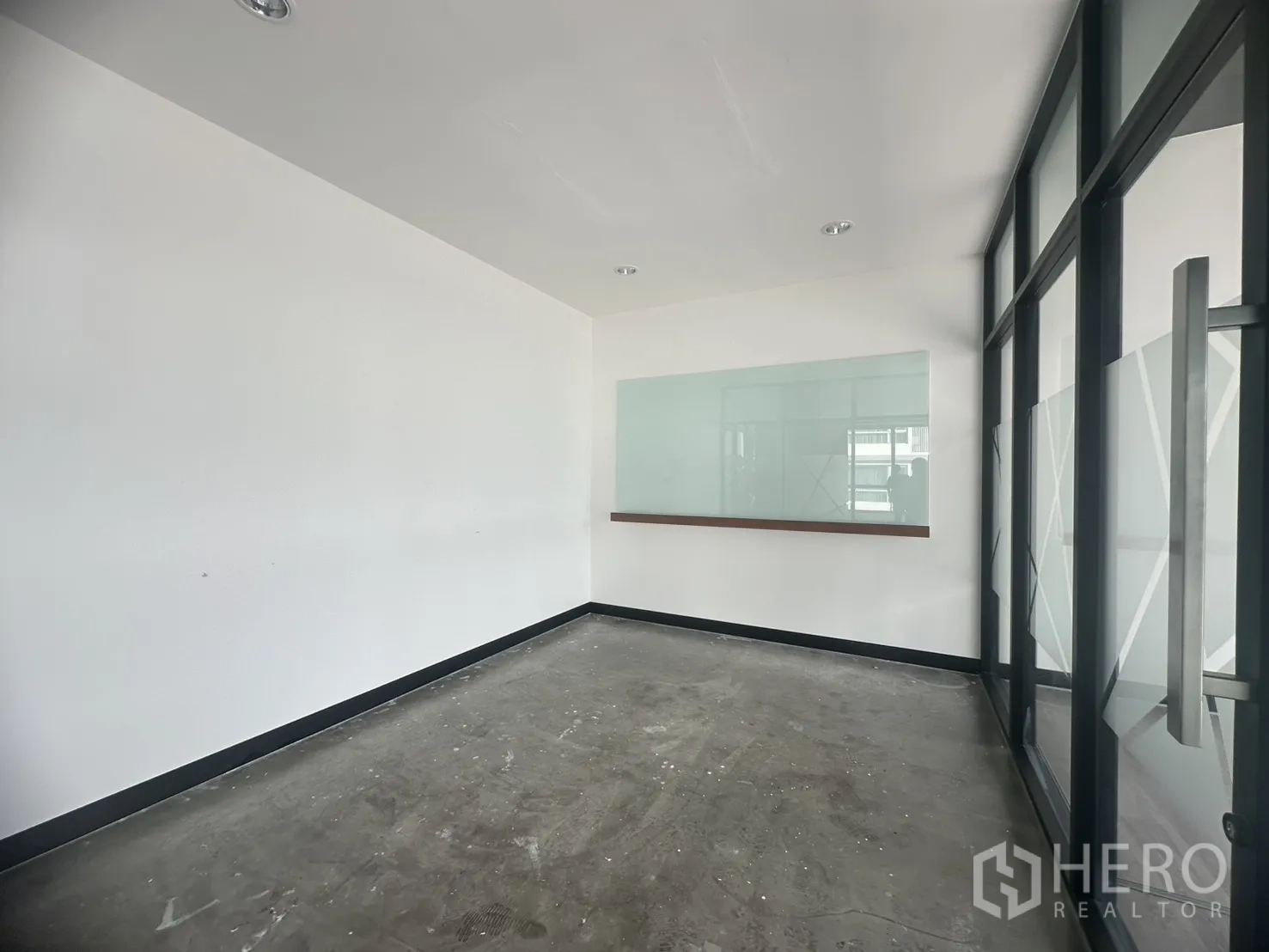 Office Space for rent in Khlong Toei, Bangkok - Private office room with a whiteboard and glass wall partitions.