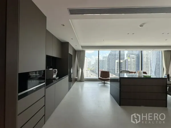 Office Space for rent in Din Daeng, Bangkok - Pantry with wall cabinets, an island counter, and expansive windows.