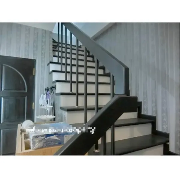 Townhouse for rent in Bang Kapi, Bangkok - Modern interior staircase with dark handrail and patterned wallpaper in the entry hall.