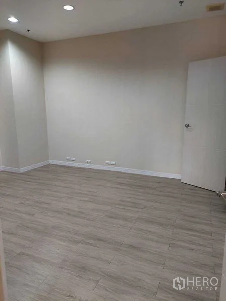 Retail Space for rent in Sathon, Bangkok - Open room with recessed ceiling lights, laminate flooring and multiple wall power outlets.