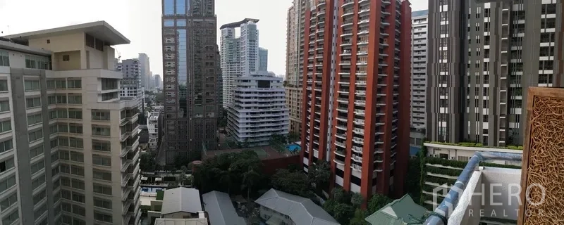 Condominium for rent in Pathum Wan, Bangkok - High-floor balcony view of Bangkok skyline with neighboring condominium towers.