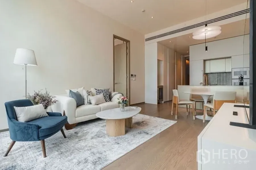 Condominium for rent - Living space with TV console, coffee table and dining set in neutral tones.