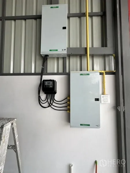 Warehouse for rent in Khlong Sam Wa, Bangkok - Close‑up of electrical control panels and meter ready for industrial power supply.