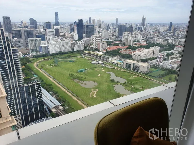 Condominium for rent in Pathum Wan, Bangkok - High-floor window view over the Royal Bangkok Sports Club golf course and Bangkok skyline.