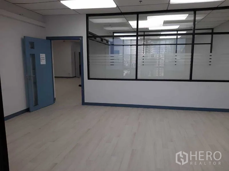 Office Space for rent in Khlong Toei, Bangkok - Reception or breakout space with interior glazing and blue door.