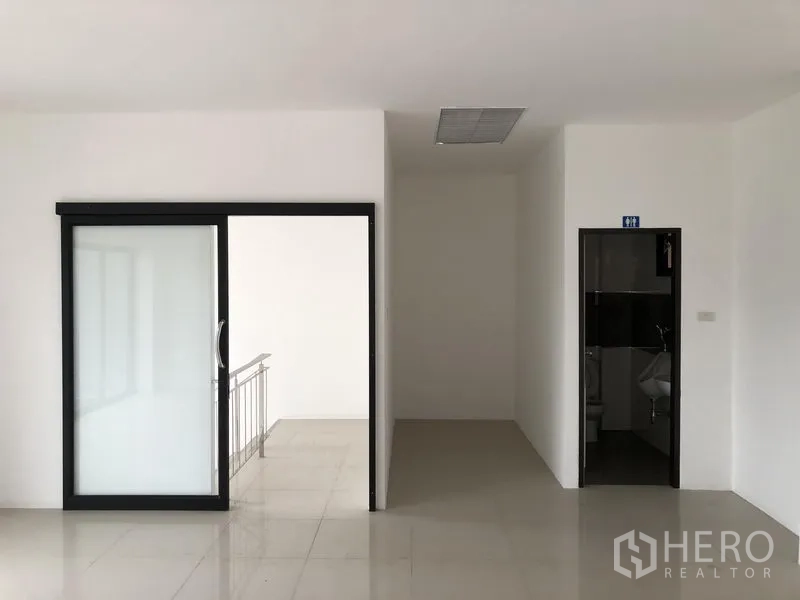 Factory for rent or sale in Bang Phli, Samut Prakan - Upper-floor office zone with sliding door entry and a separate restroom.