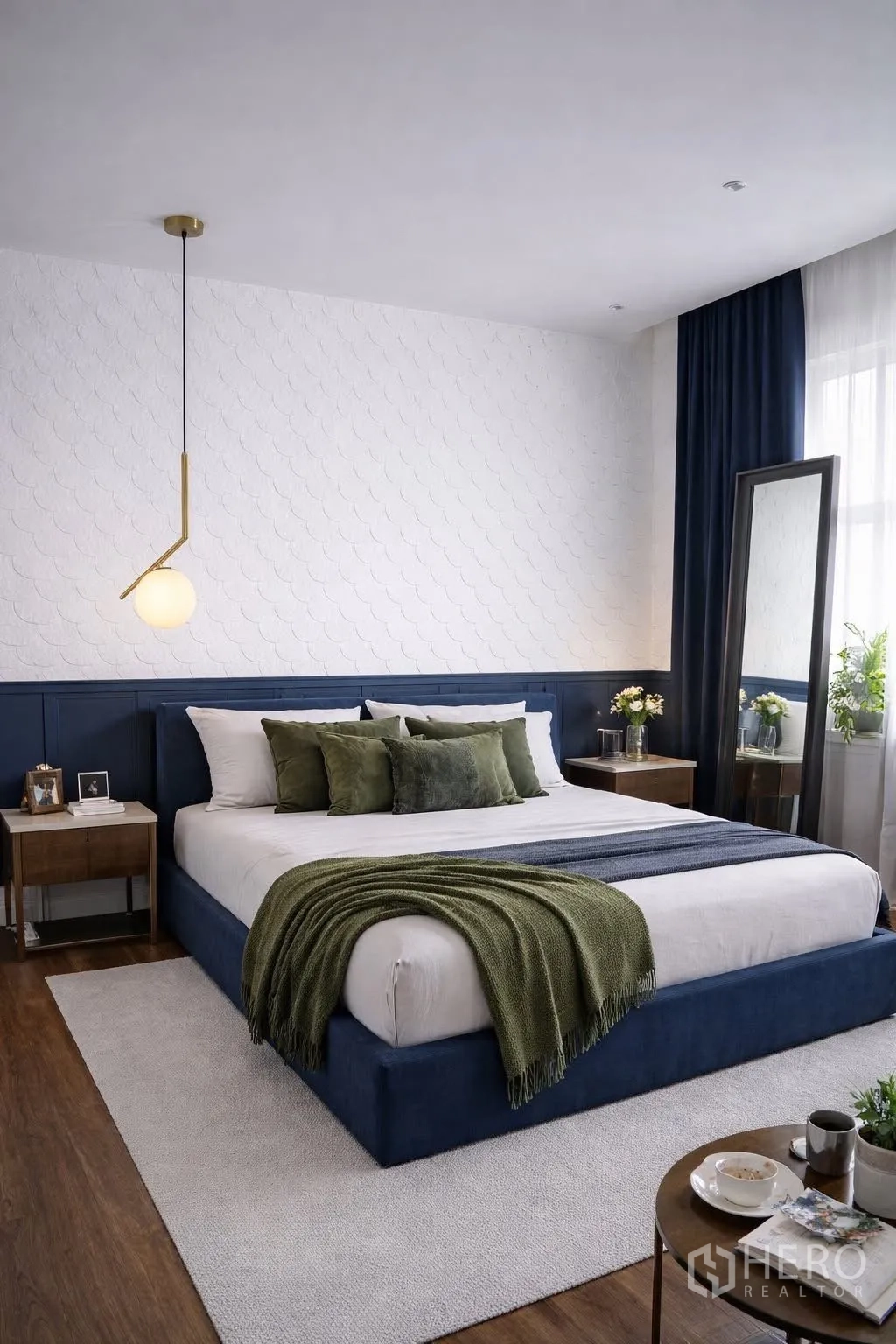 Detached House for rent in Suan Luang, Bangkok - Cozy bedroom with a dark blue bedframe, pendant light and wood floors.