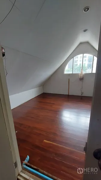 Office Space for rent in Watthana, Bangkok - Attic-style workspace viewed from the doorway, arched window, recessed lighting and glossy wood flooring.