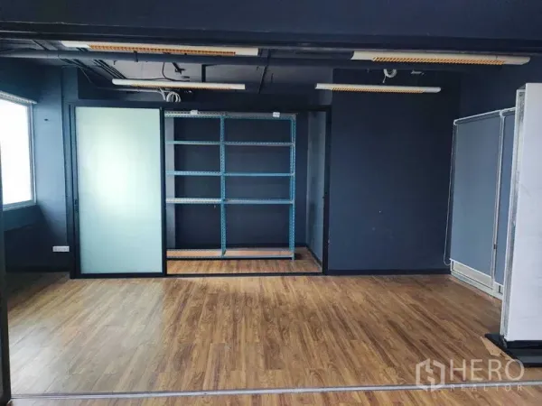 Office Space for rent in Watthana, Bangkok - Central section with metal storage shelving set into a recessed nook.