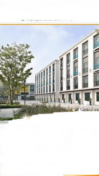 Home Office for rent in Wang Thonglang, Bangkok - Row of townhouse-style home office buildings in a landscaped compound.