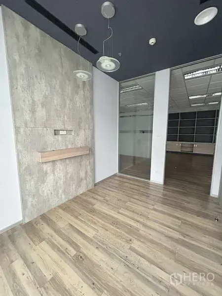Office Space for rent - Private office with pendant lights, glass door and wood-look flooring