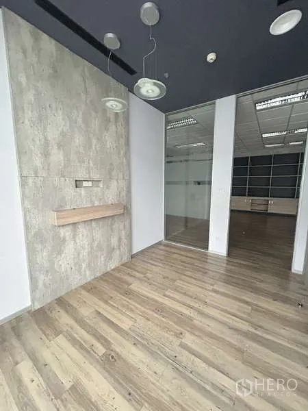 Office Space for rent - Private office with pendant lights, glass door and wood-look flooring