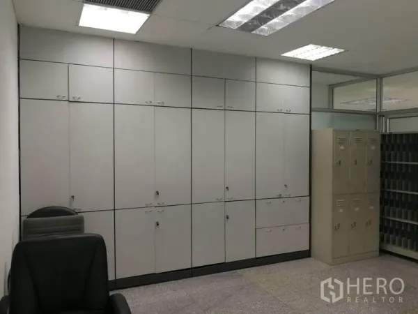 Office Space for rent in Bang Na, Bangkok - Built-in floor-to-ceiling storage cabinets and staff lockers in a bright office room.