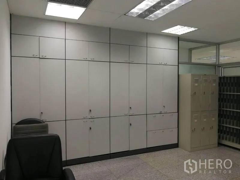 Office Space for rent in Bang Na, Bangkok - Built-in floor-to-ceiling storage cabinets and staff lockers in a bright office room.