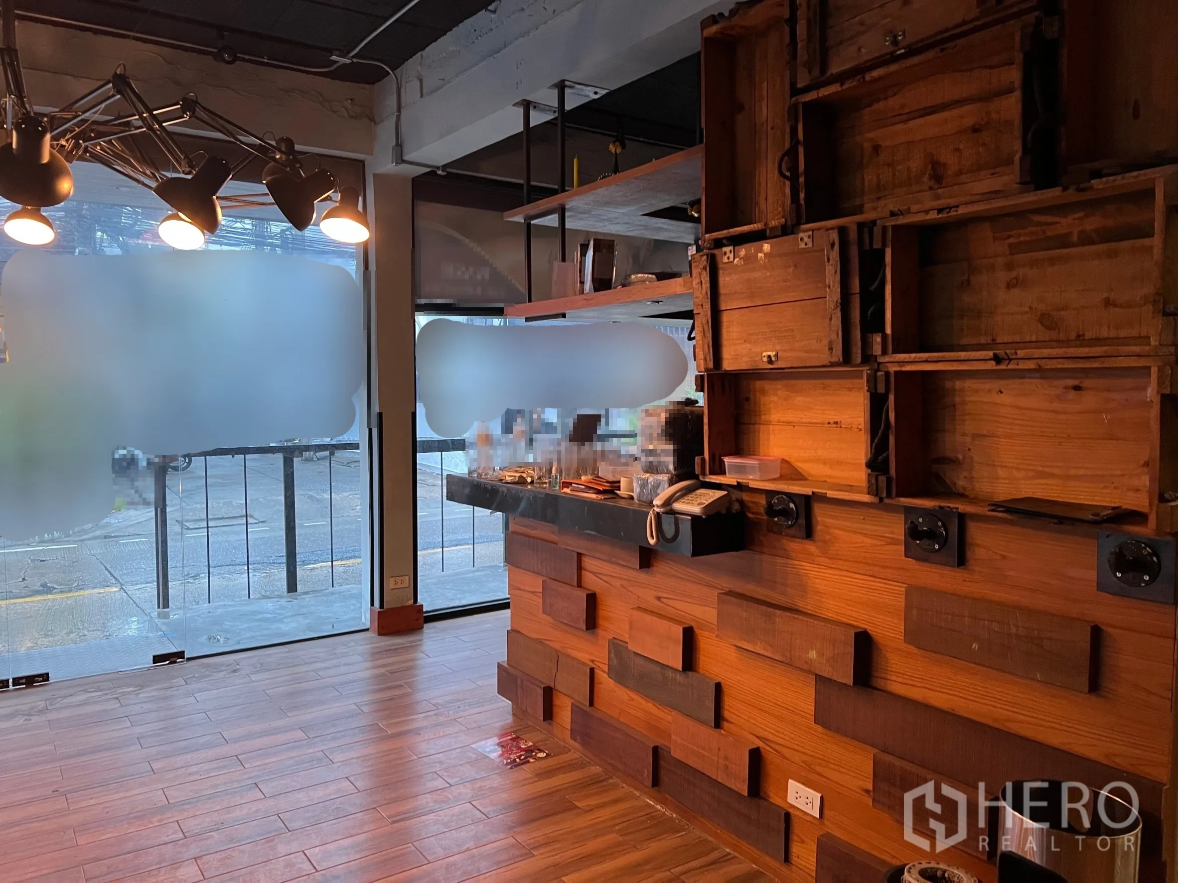 Retail Space for rent in Watthana, Bangkok - Front counter and shelving with frosted glass storefront inside Watthana retail unit.