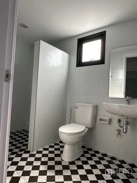 Warehouse for rent in Bang Phli, Samut Prakan - Restroom with partitioned wet area, sink, and checkered tile floor.