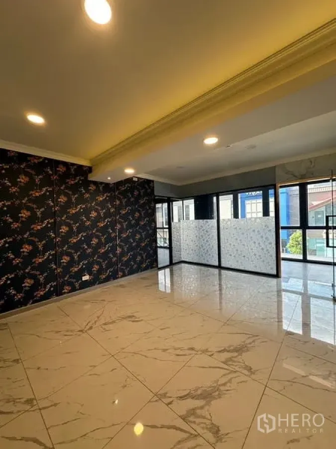 Retail Space for rent in Bang Na, Bangkok - Bright retail space interior with marble-look tiles, recessed lighting and glass partitions allowing natural light.