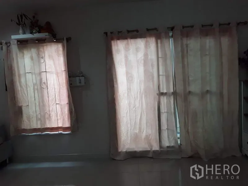 Detached House for rent in Suan Luang, Bangkok - Multiple windows with pale curtains filtering soft natural light into the living area