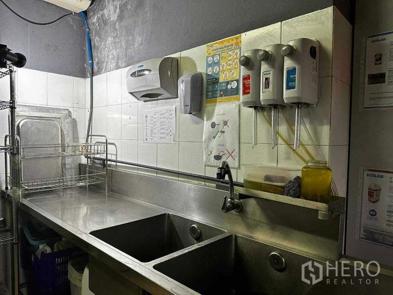 Retail Space for rent in Watthana, Bangkok - Commercial double sink with dispensers in a stainless-steel wash area.