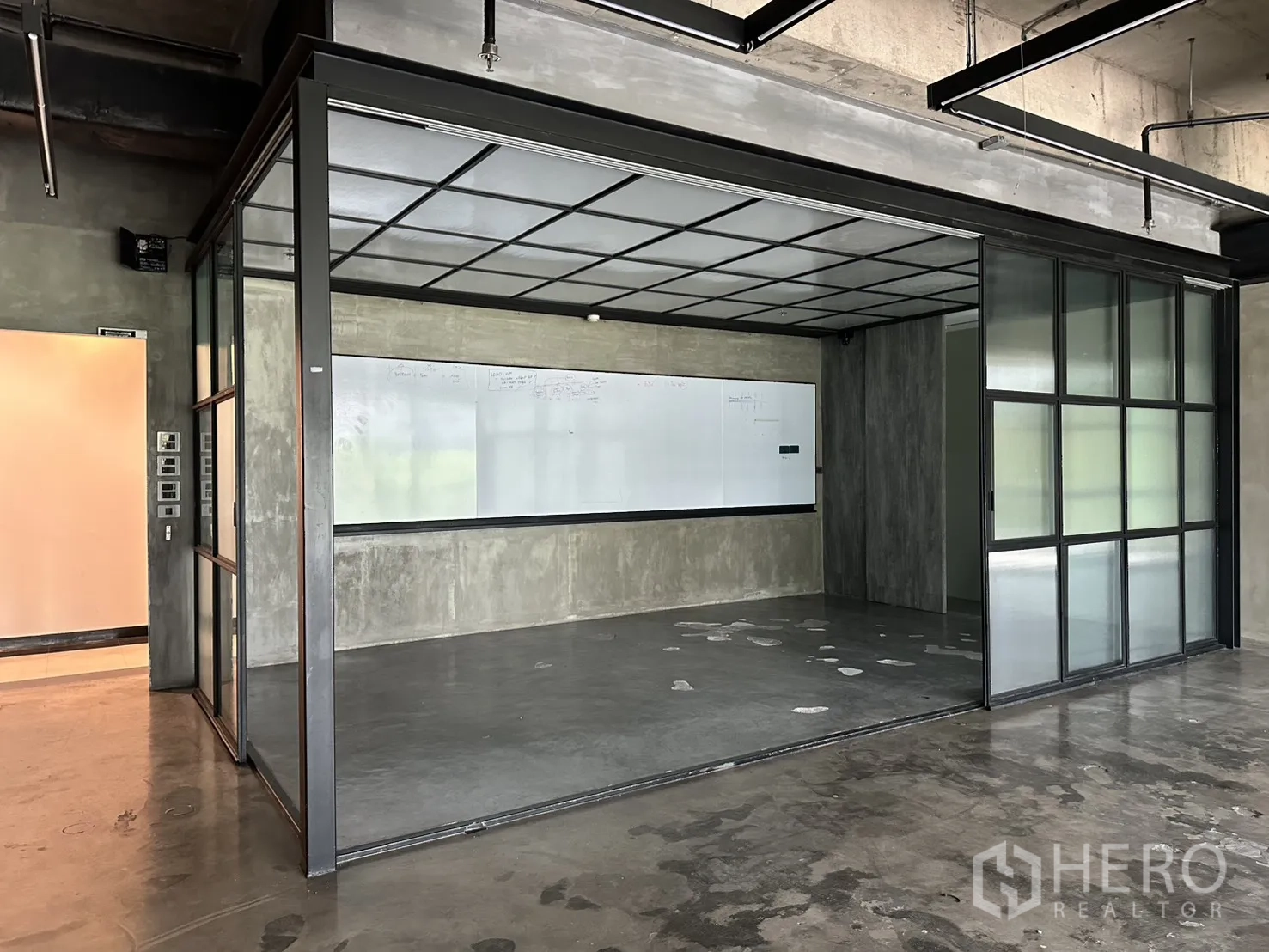 Office Space for rent in Pathum Wan, Bangkok - Enclosed meeting room with sliding glass panels, whiteboard wall, and polished concrete floor.
