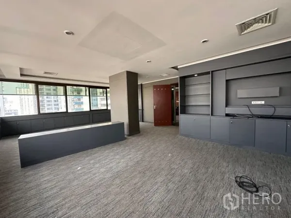 Office Space for rent in Watthana, Bangkok - Open-plan office with built-in shelving, long counter and city views
