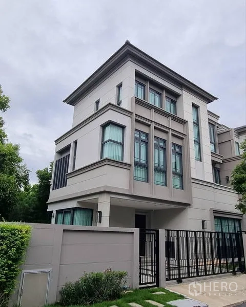 Detached House for rent - Modern three-storey detached house facade with tall windows and a gated front yard.