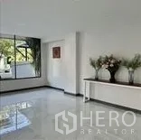 Home Office for rent in Wang Thonglang, Bangkok - Bright corner room with large windows and a display console.