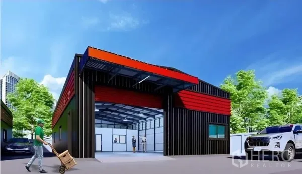 Warehouse for rent in Lat Phrao, Bangkok - Street-facing warehouse frontage with a covered loading bay and a driveway suitable for vans and trucks.