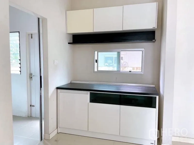 Detached House for rent in Bang Na, Bangkok - Pantry area with white built-in cabinetry and countertop storage.