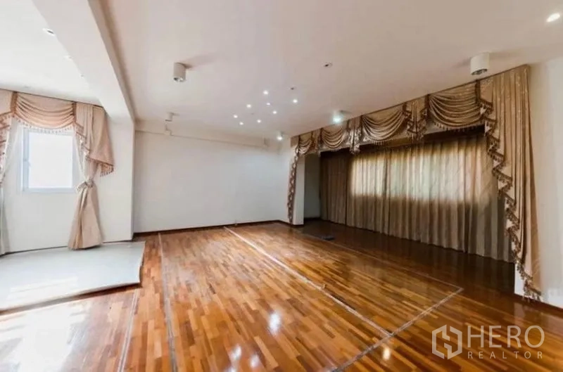 Home Office for rent or sale - Polished hardwood room with decorative curtains and spotlights, ideal for meeting or studio use.